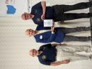Glenn Johnson, WØGJ (left), and Gregg Marco, W6IZT (right) accept the NCDXF DXcellence award for the PJ6Y DXpedition to Sable Island.